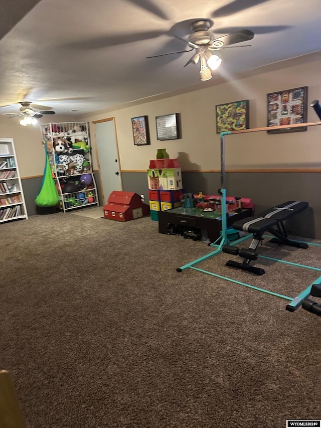 recreation room featuring carpet and ceiling fan