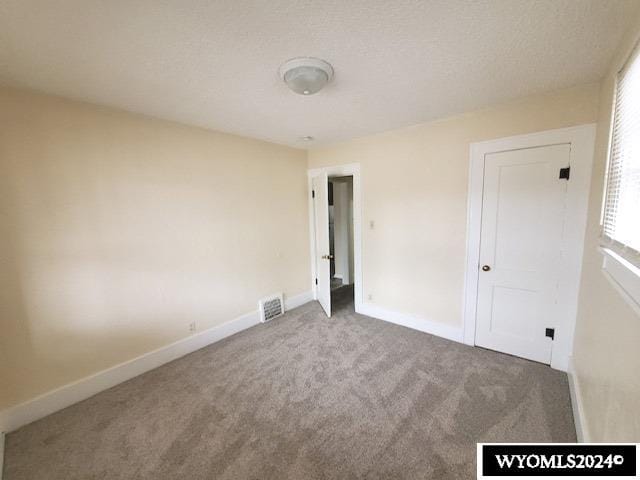 unfurnished bedroom featuring carpet flooring