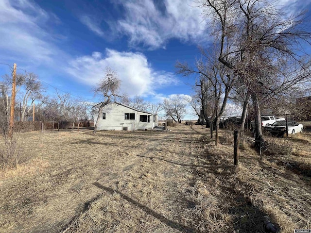 view of yard with a rural view