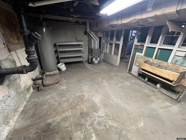 basement featuring gas water heater and heating unit