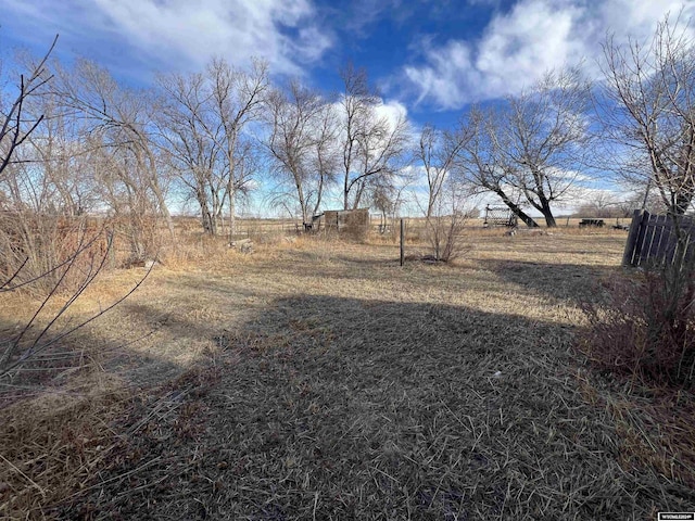 view of yard with a rural view