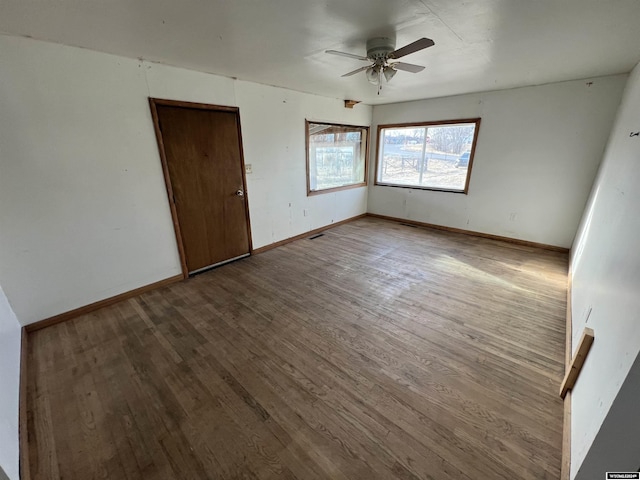 interior space with ceiling fan and wood-type flooring