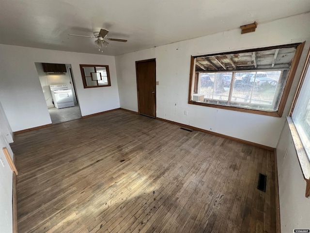 spare room featuring ceiling fan and dark wood-type flooring