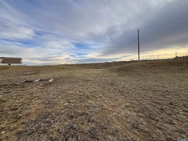 view of yard with a rural view