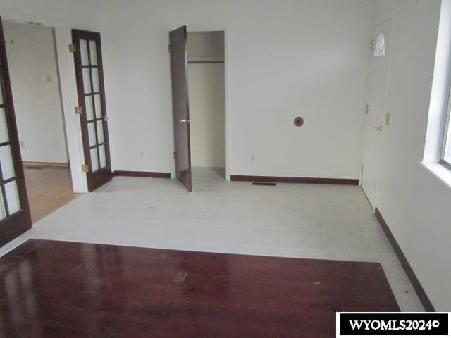 spare room featuring french doors