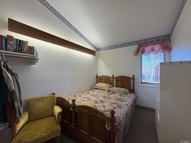 bedroom featuring dark colored carpet, a textured ceiling, and vaulted ceiling