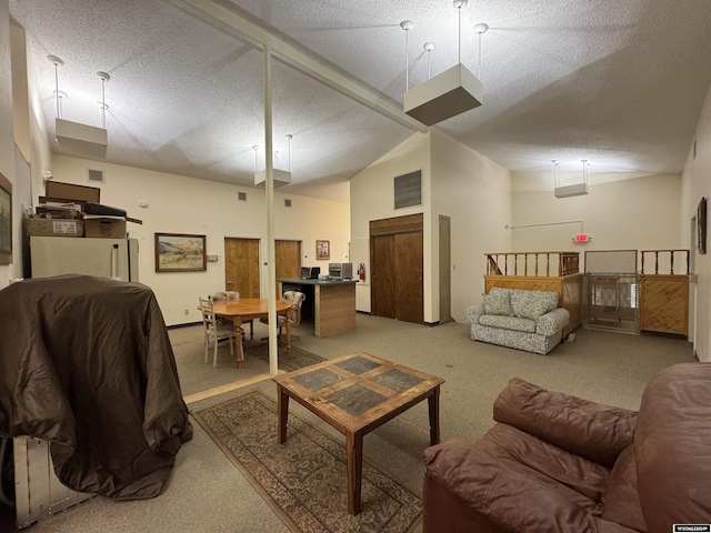 living room featuring carpet flooring, a textured ceiling, and high vaulted ceiling