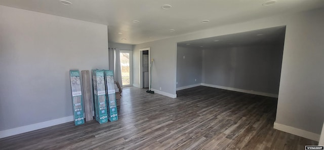 500 Madison, Rawlins, WY 82301 - spare room featuring baseboards and dark wood finished floors