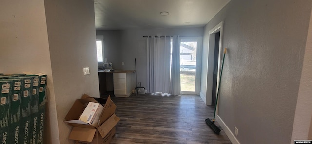 500 Madison, Rawlins, WY 82301 - interior space featuring a textured wall, dark wood-style floors, and baseboards