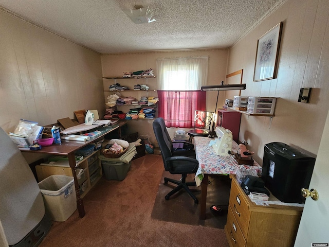 home office with dark colored carpet, a textured ceiling, and wooden walls