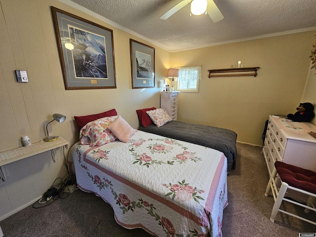 carpeted bedroom with ceiling fan, ornamental molding, and a textured ceiling