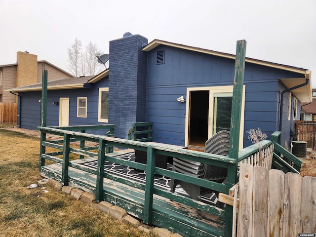 rear view of house with a wooden deck