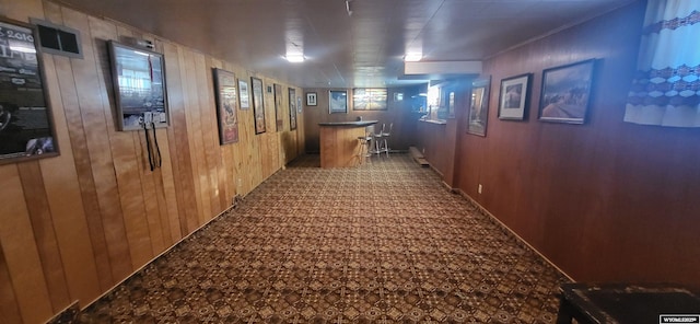 hallway with wooden walls