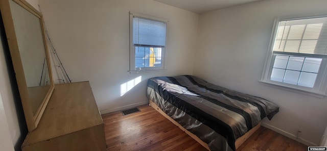 bedroom featuring dark hardwood / wood-style flooring