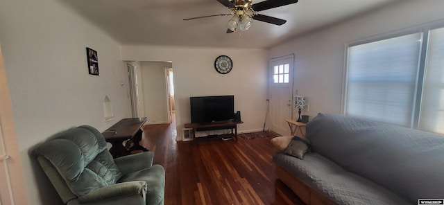 living room with dark hardwood / wood-style floors and ceiling fan