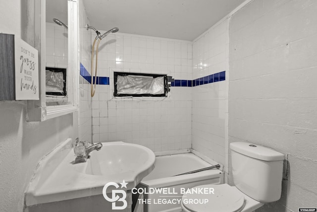 bathroom featuring vanity, bathing tub / shower combination, and toilet