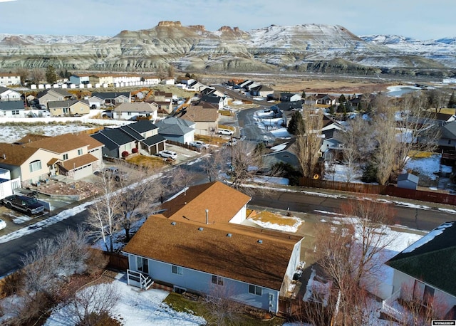 snowy aerial view featuring a mountain view