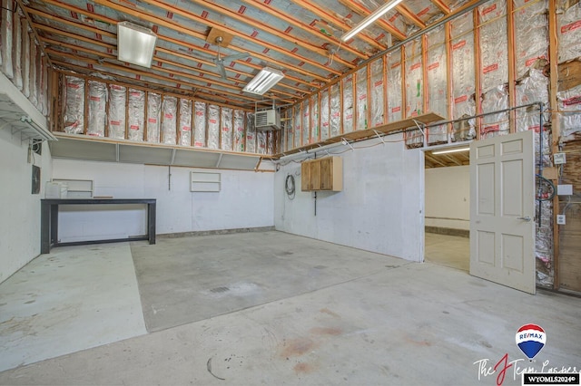 garage featuring a wall mounted AC