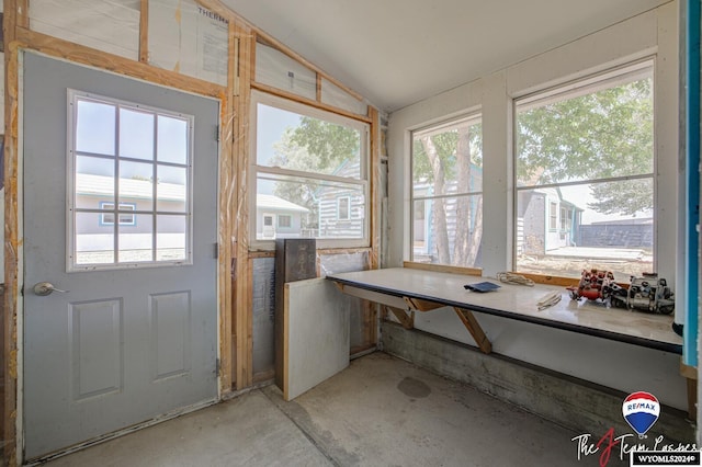 unfurnished sunroom featuring lofted ceiling