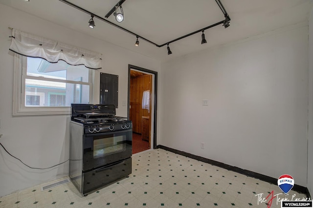 kitchen featuring black gas range and rail lighting