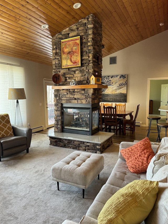 carpeted living room with a fireplace, vaulted ceiling, baseboard heating, and wood ceiling