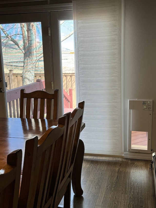 dining area with dark hardwood / wood-style flooring