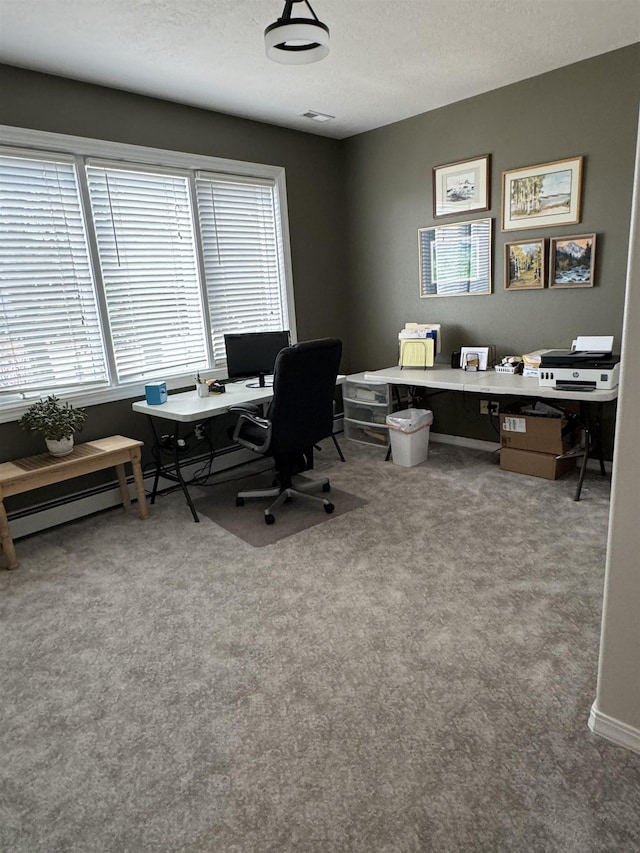 home office with carpet floors, a textured ceiling, and a baseboard heating unit