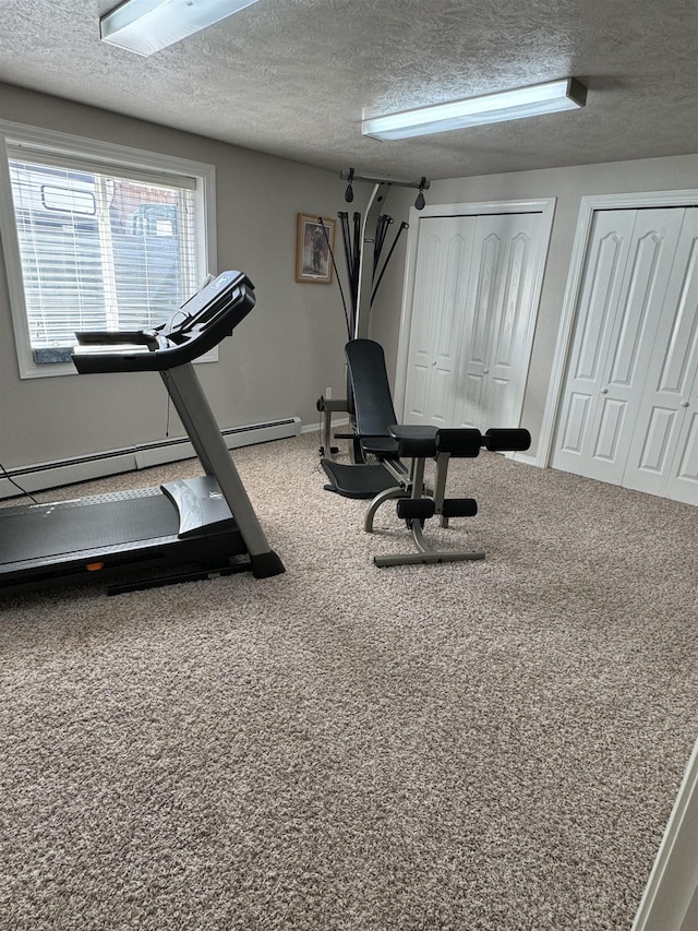 exercise room featuring a textured ceiling