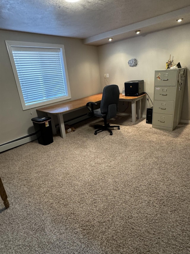 carpeted home office featuring a textured ceiling