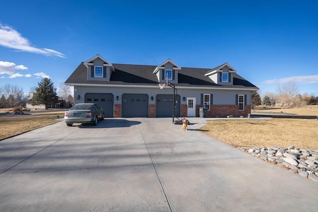 cape cod-style house featuring a garage