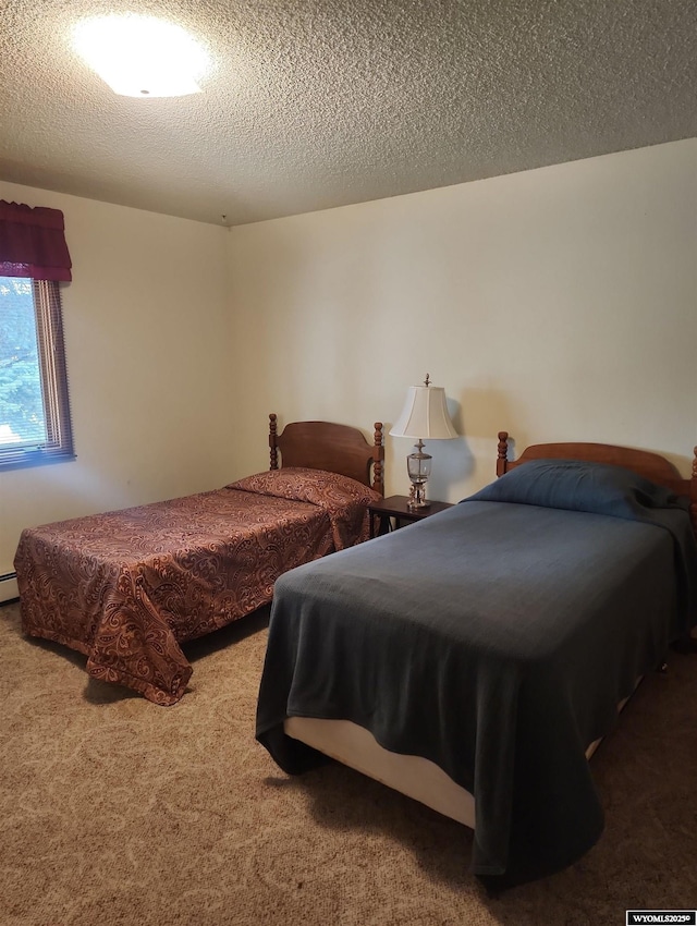 carpeted bedroom featuring a textured ceiling and pool table