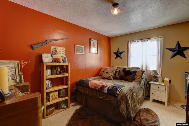 carpeted bedroom with a textured ceiling