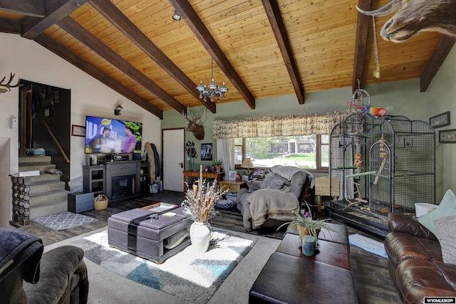 living room featuring vaulted ceiling with beams, wood ceiling, and a notable chandelier