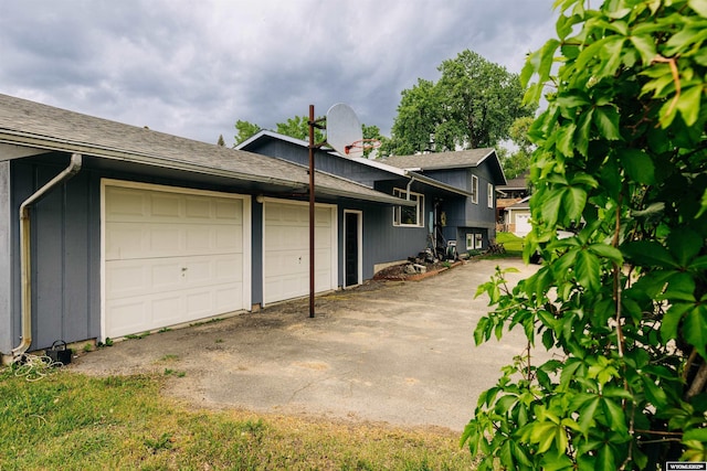 view of property exterior featuring a garage