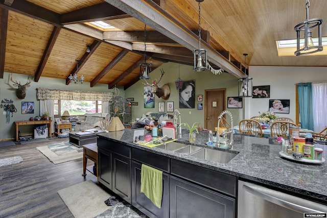 kitchen featuring stainless steel dishwasher, vaulted ceiling with skylight, wood ceiling, sink, and decorative light fixtures