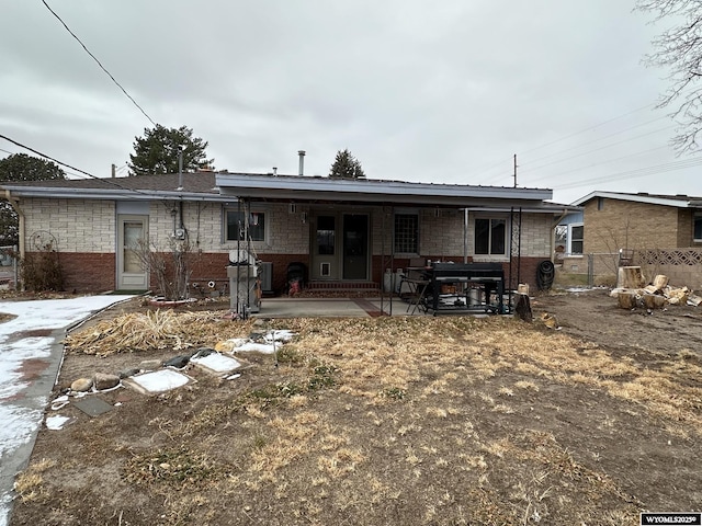 rear view of house featuring a patio