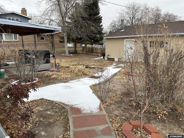 view of yard layered in snow