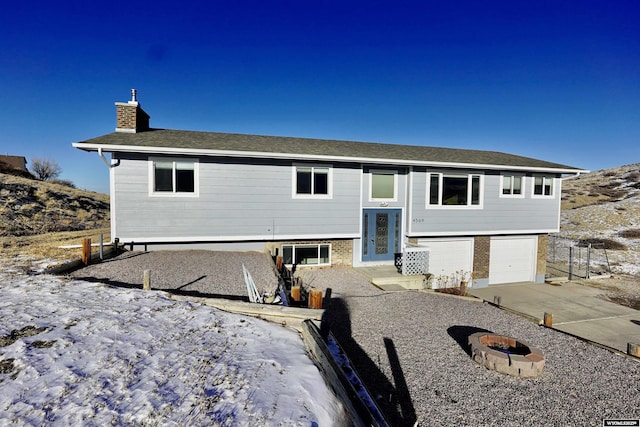 raised ranch featuring a garage