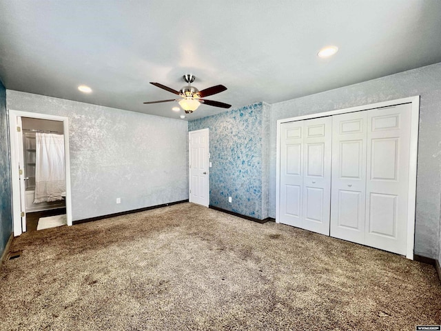 unfurnished bedroom with carpet flooring, connected bathroom, ceiling fan, and a closet