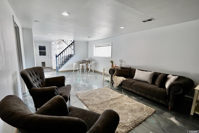 living room with a textured ceiling