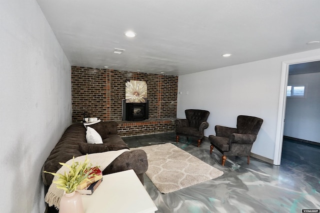 living room featuring brick wall and concrete floors