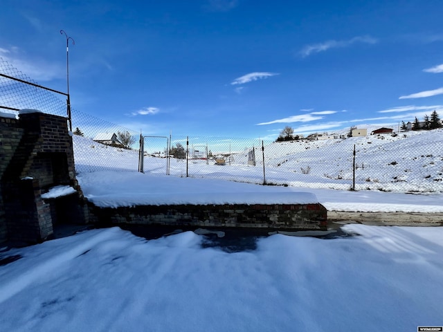 view of yard layered in snow