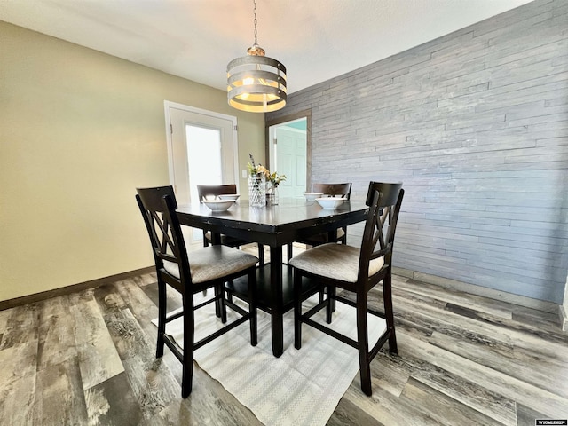 dining space featuring a chandelier and hardwood / wood-style flooring