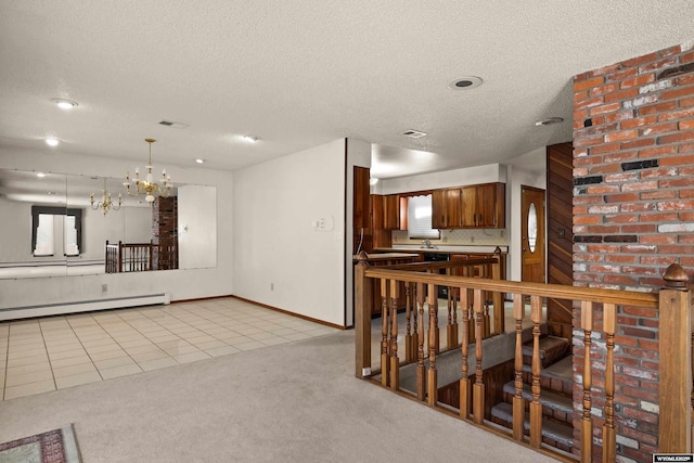 kitchen featuring a baseboard radiator, a chandelier, light carpet, and a textured ceiling