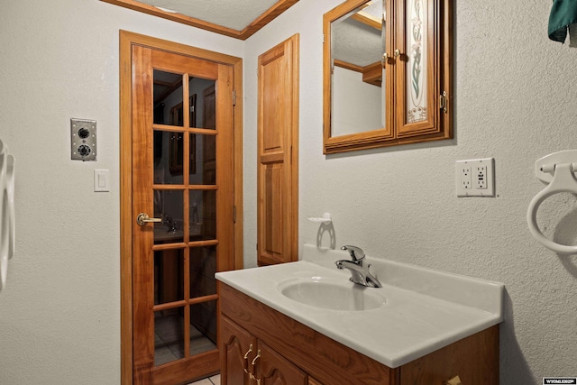 bathroom featuring vanity and crown molding