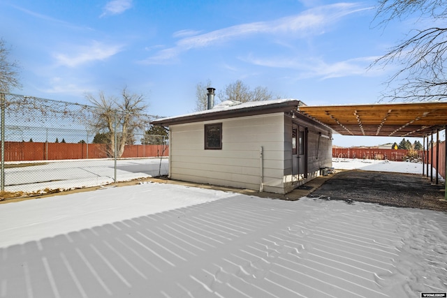 exterior space featuring a carport