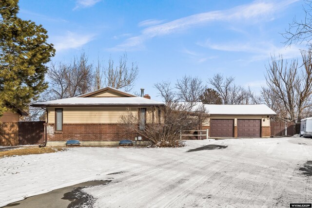 ranch-style home featuring a garage