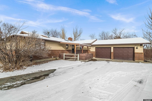 single story home featuring a garage