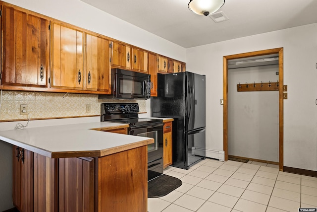 kitchen featuring tasteful backsplash, kitchen peninsula, light tile patterned floors, and black appliances