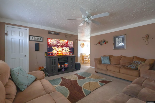 carpeted living room featuring ceiling fan and a textured ceiling